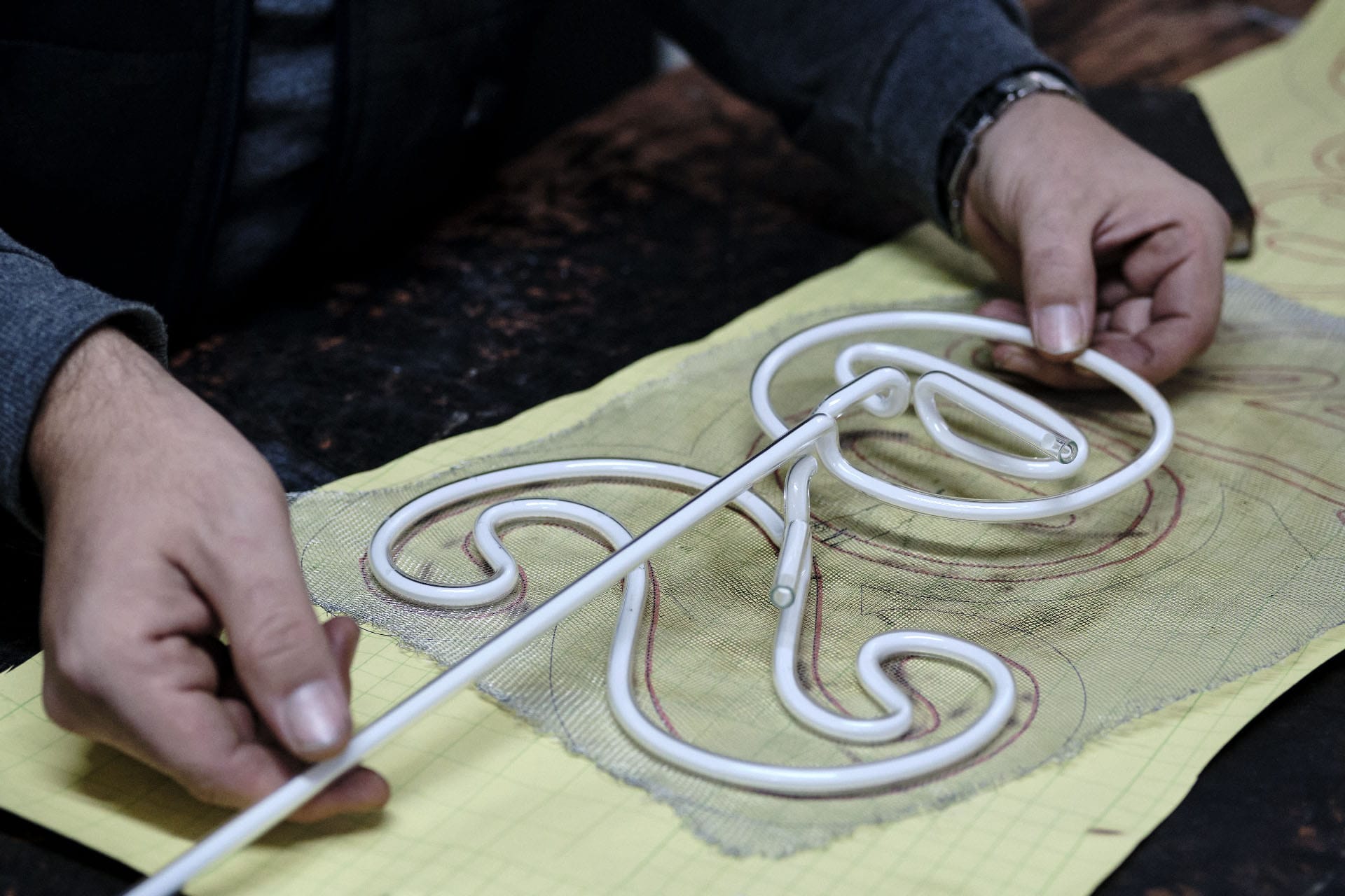 Man,Working,On,A,Neon,Sign,Assembling,It,Based,On